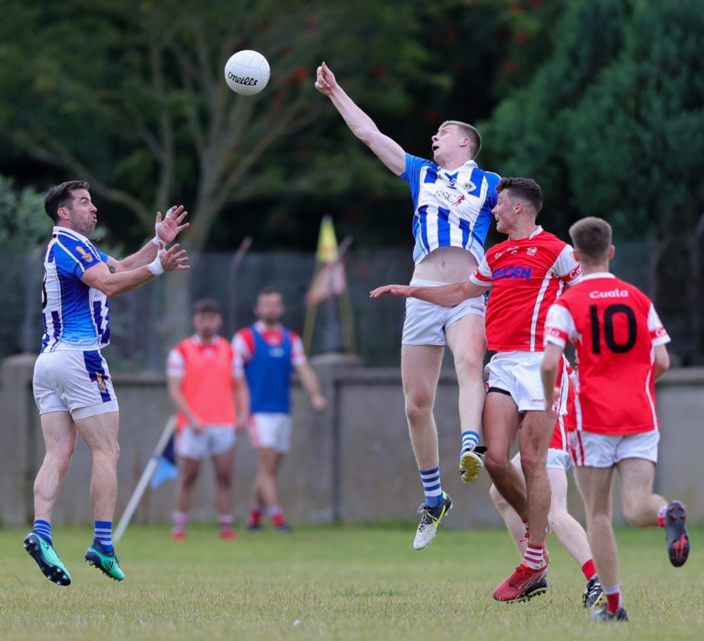 Boden's Michael Darragh MacAuley and Michael McDonald challenge for a ball during Saturday's game against Cuala. Credit: John Kirwan